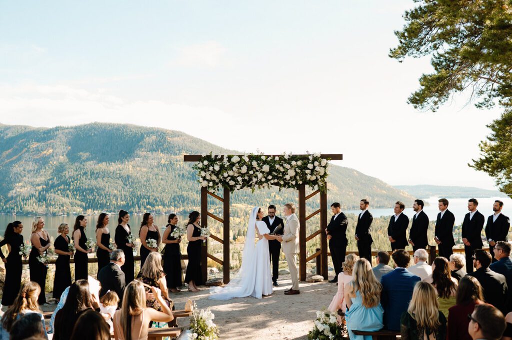 An outdoor mountain wedding ceremony, showing the importance of viewing full galleries to ensure your photographer can capture authentic moments during the ceremony.