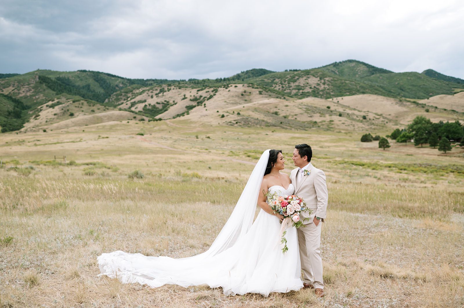Couple embracing each other amongst one of the many outdoor wedding venues in Colorado.