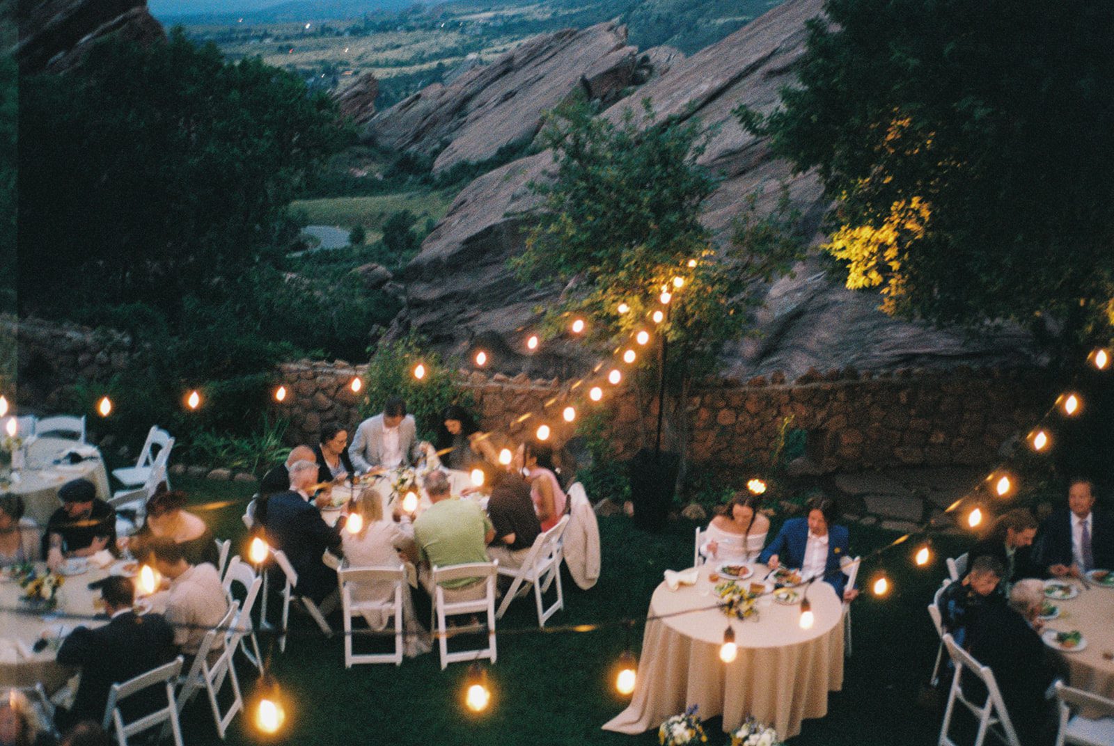 Outdoor reception with string lights and dinner tables set up at an intimate wedding venue in Colorado.Small Intimate Wedding Venues in Colorado | Menique Koos Photo