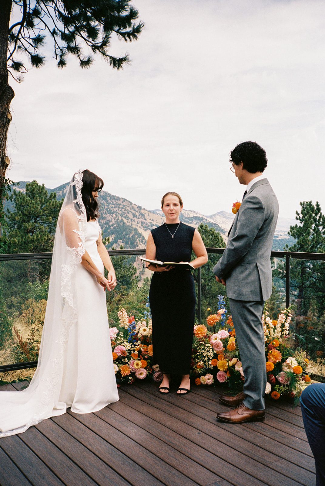 Intimate wedding ceremony overlooking the mountains at a small wedding venue in Colorado with mountain views. 