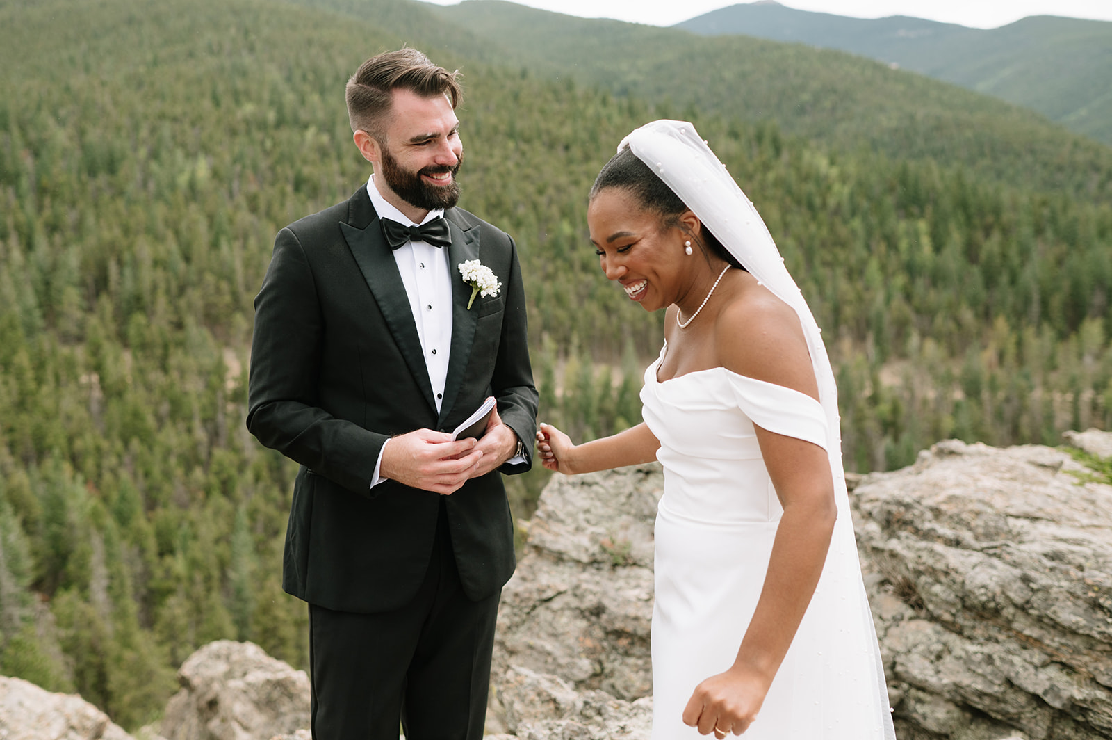 bride and groom laughing during a private vow reading at their north star gatherings wedding