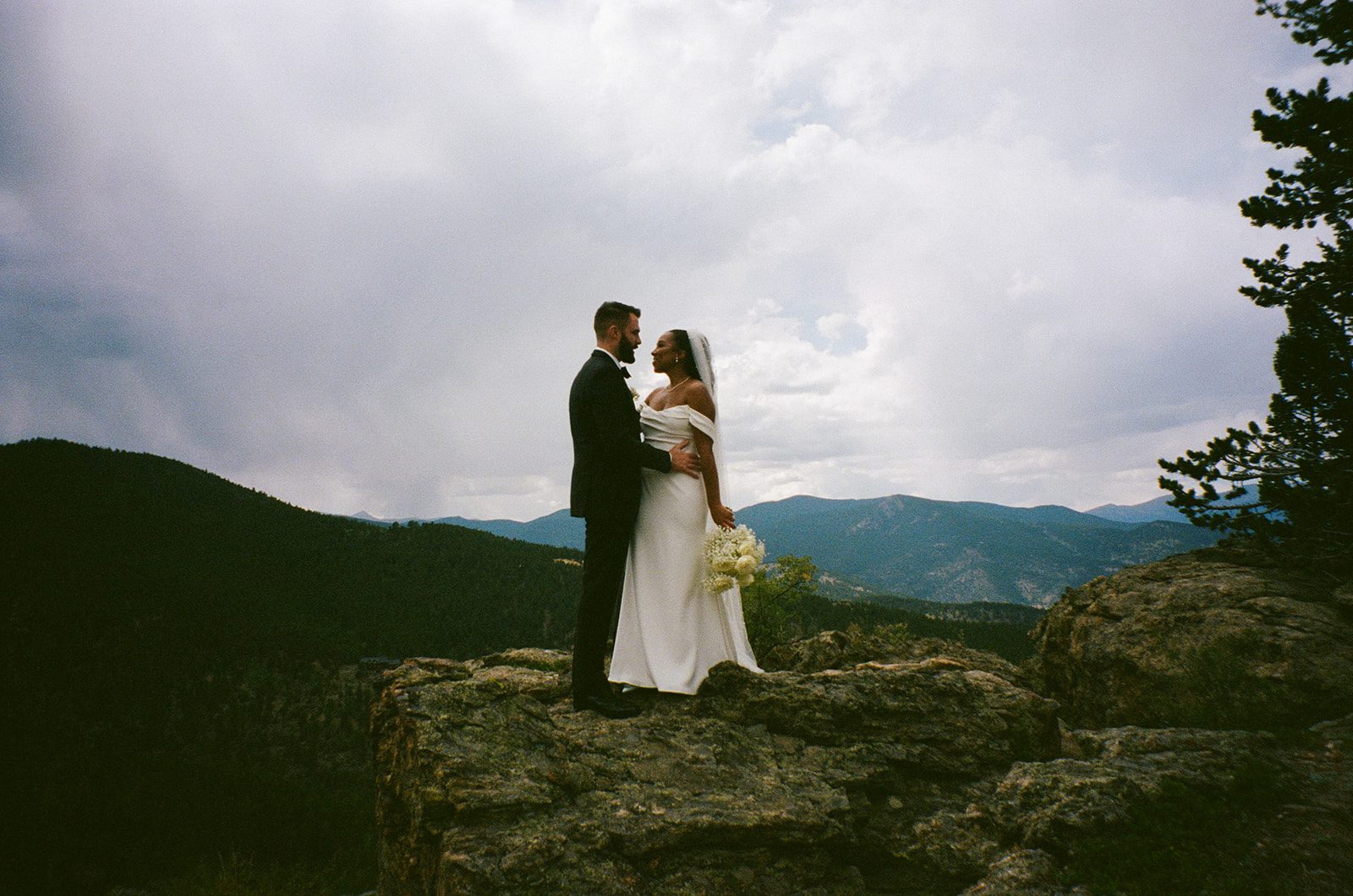 bride and groom embracing during their portrait session at their north star gatherings wedding