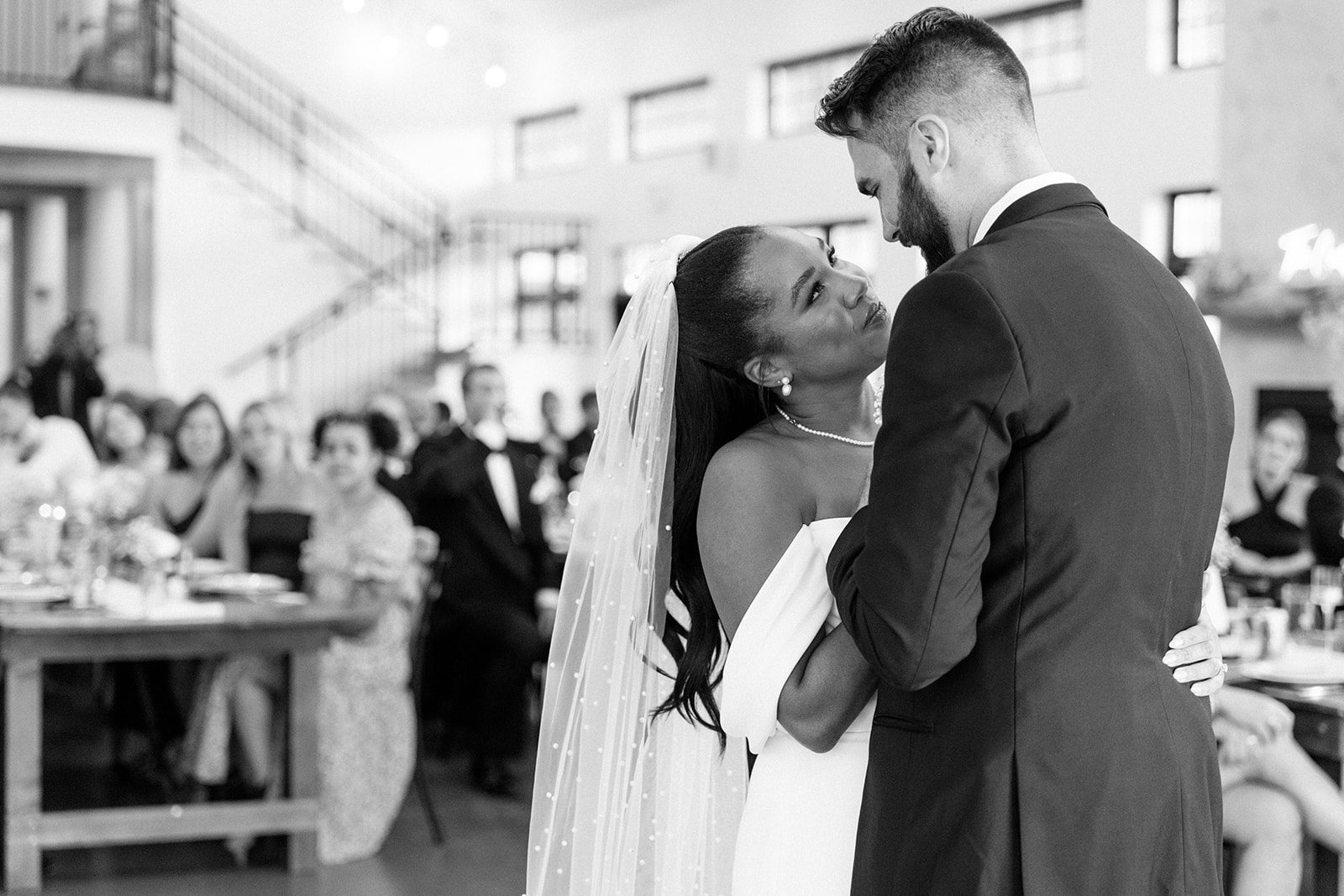 black and white portrait of bride and groom during their first dance at their north star gatherings wedding reception