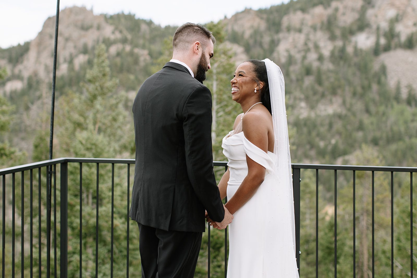 bride and groom sharing a heartfelt first-look moment alone before walking down the aisle for their north star gatherings wedding