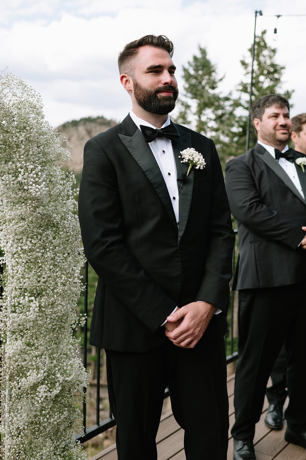 groom waiting for his bride to walk down the aisle at their north star gatherings wedding