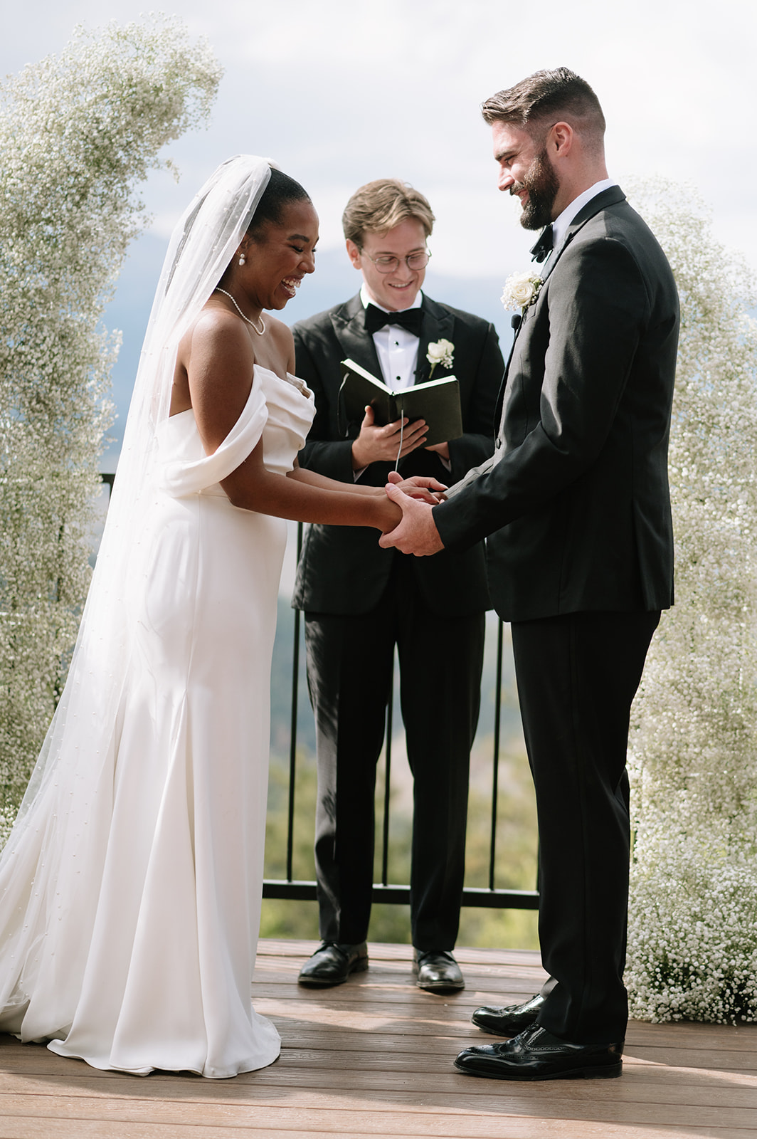 bride and groom laughing during their north star gatherings wedding ceremony