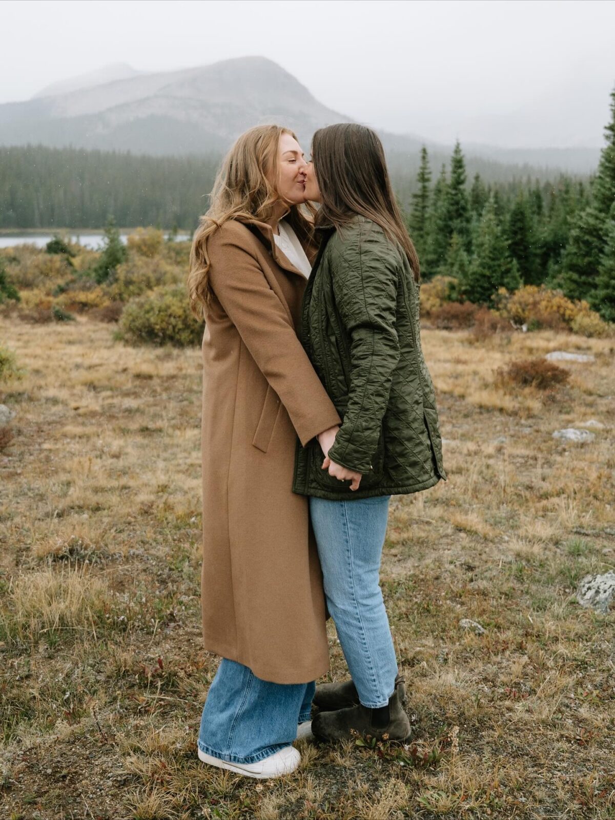 portrait of a couple kissing, showing a perfect example of what to wear for engagement photos in colorado